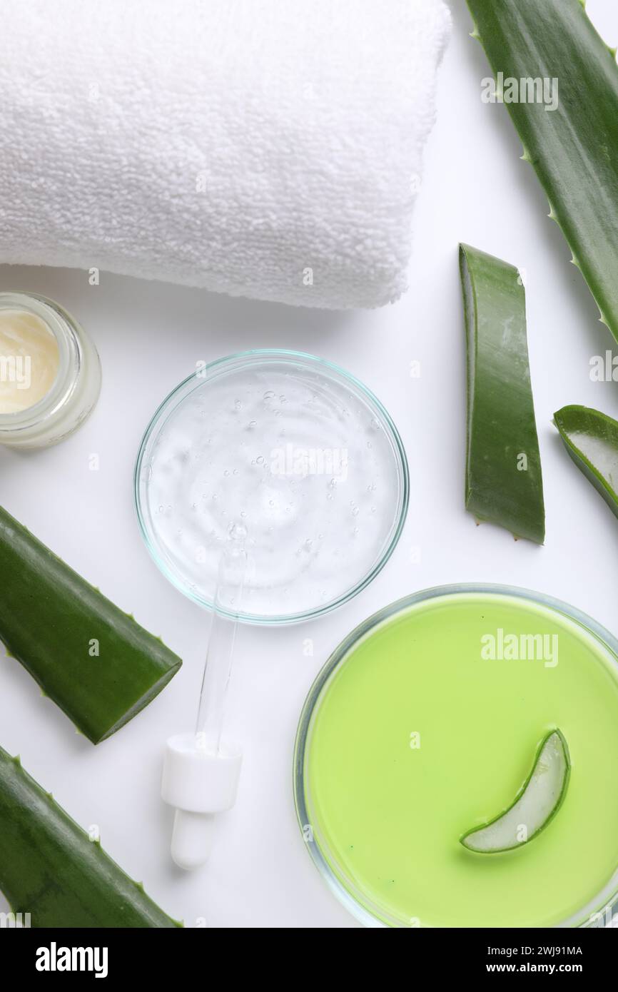Flat lay composition with cosmetic products and cut aloe leaves on ...