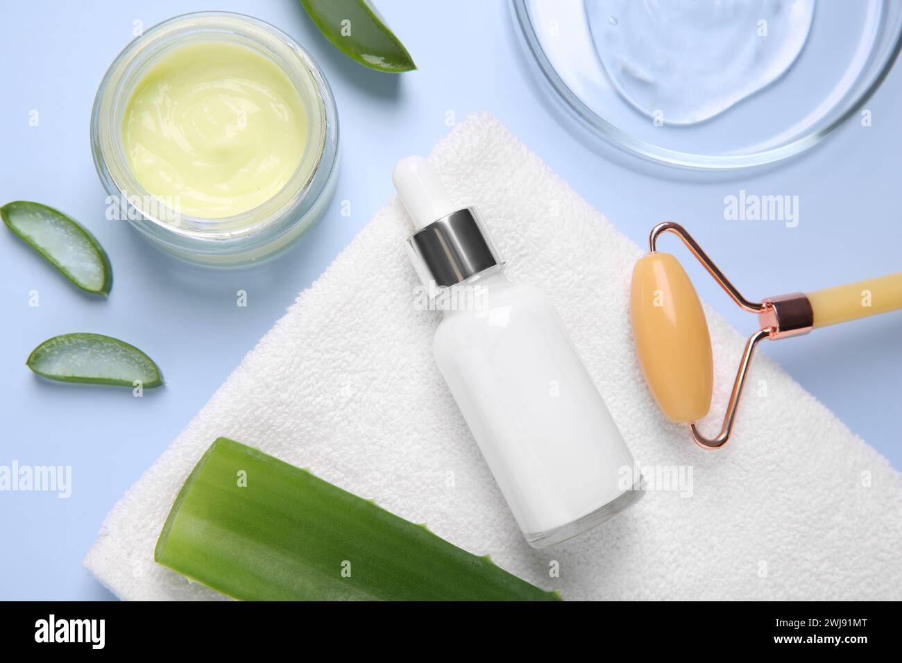 Flat lay composition with cosmetic products and cut aloe leaves on ...