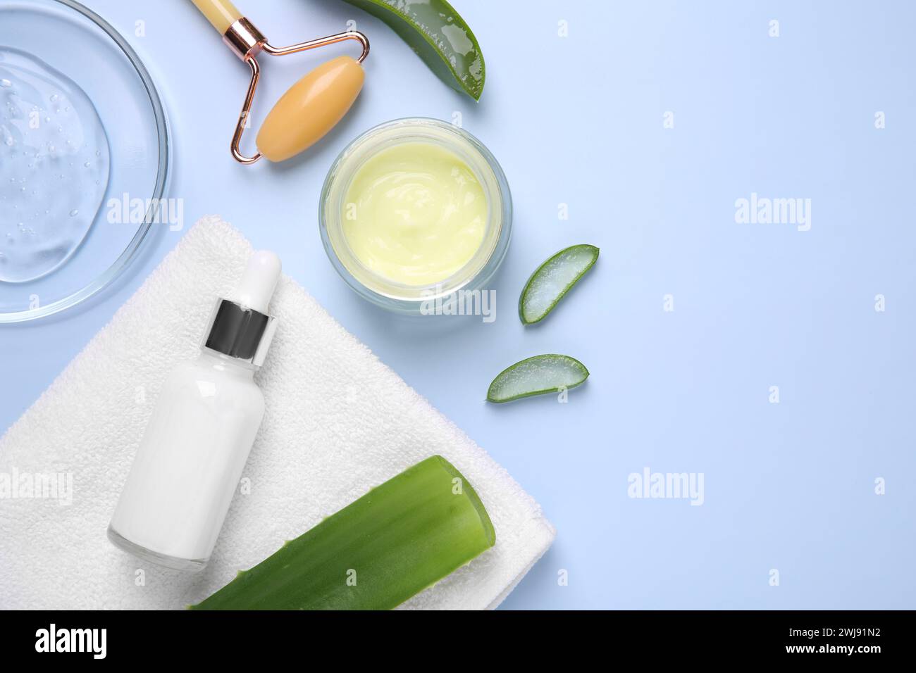 Flat lay composition with cosmetic products and cut aloe leaves on ...