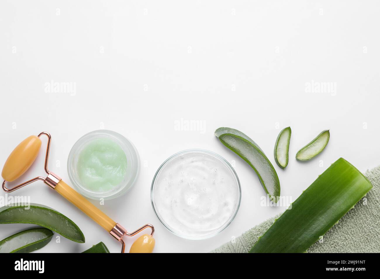 Flat lay composition with cosmetic products and cut aloe leaves on ...