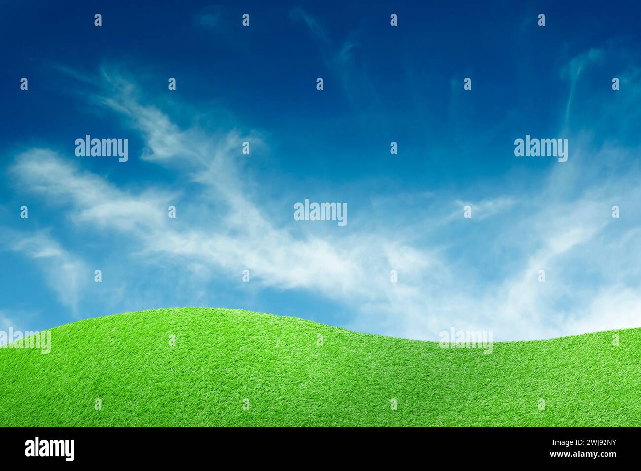 Lush green grass under blue sky with clouds Stock Photo - Alamy
