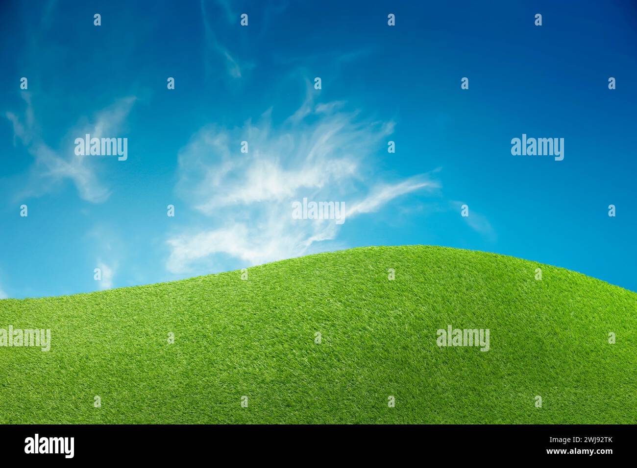 Lush green grass under blue sky with clouds Stock Photo - Alamy