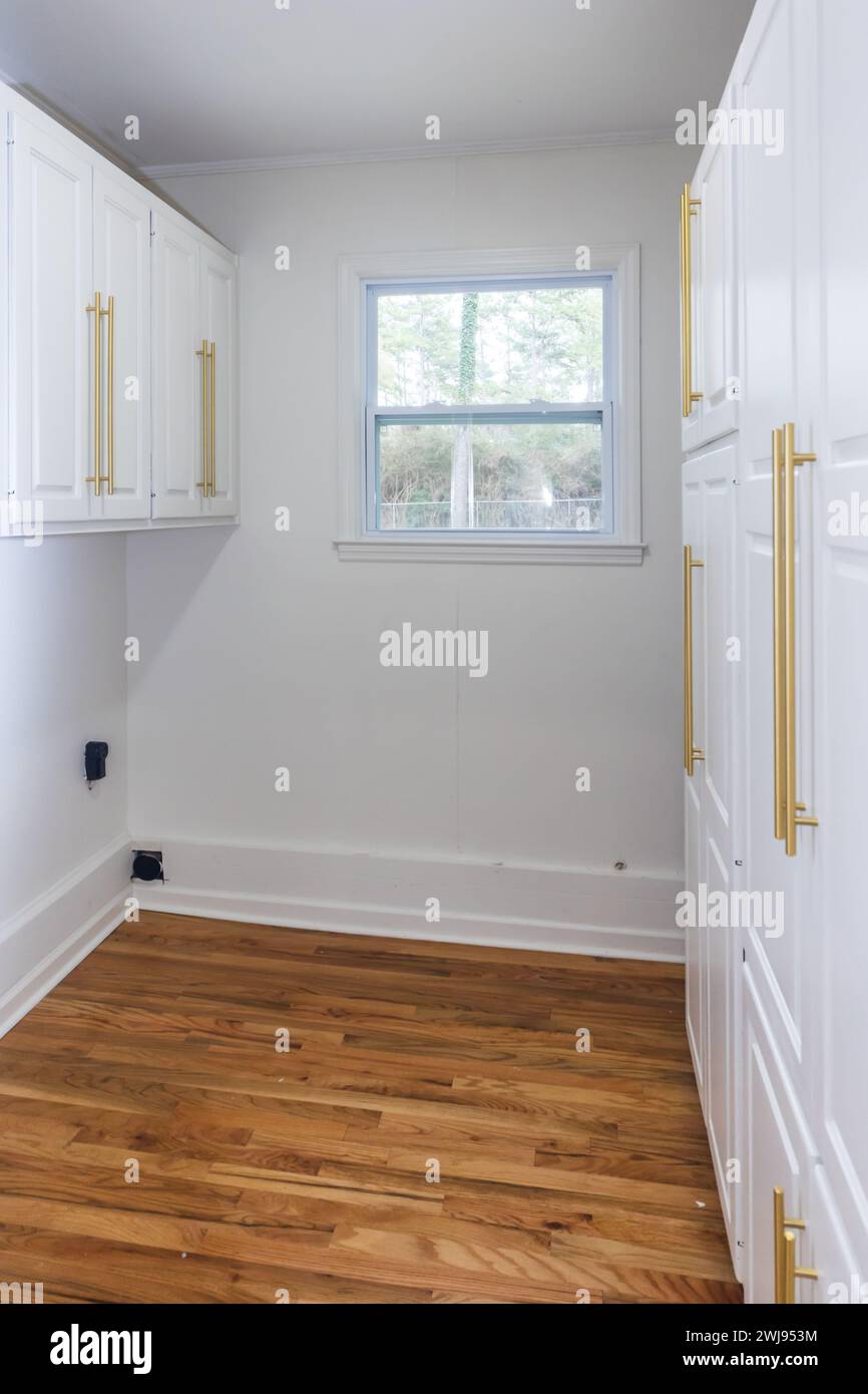 Updated white shaker cabinets with elegant gold sleek thin hardware in ...