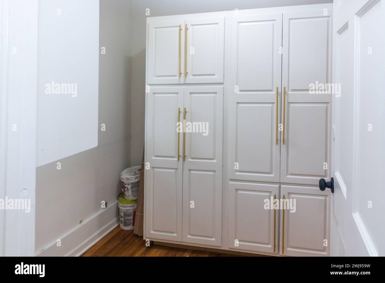 Updated white shaker cabinets with elegant gold sleek thin hardware in ...