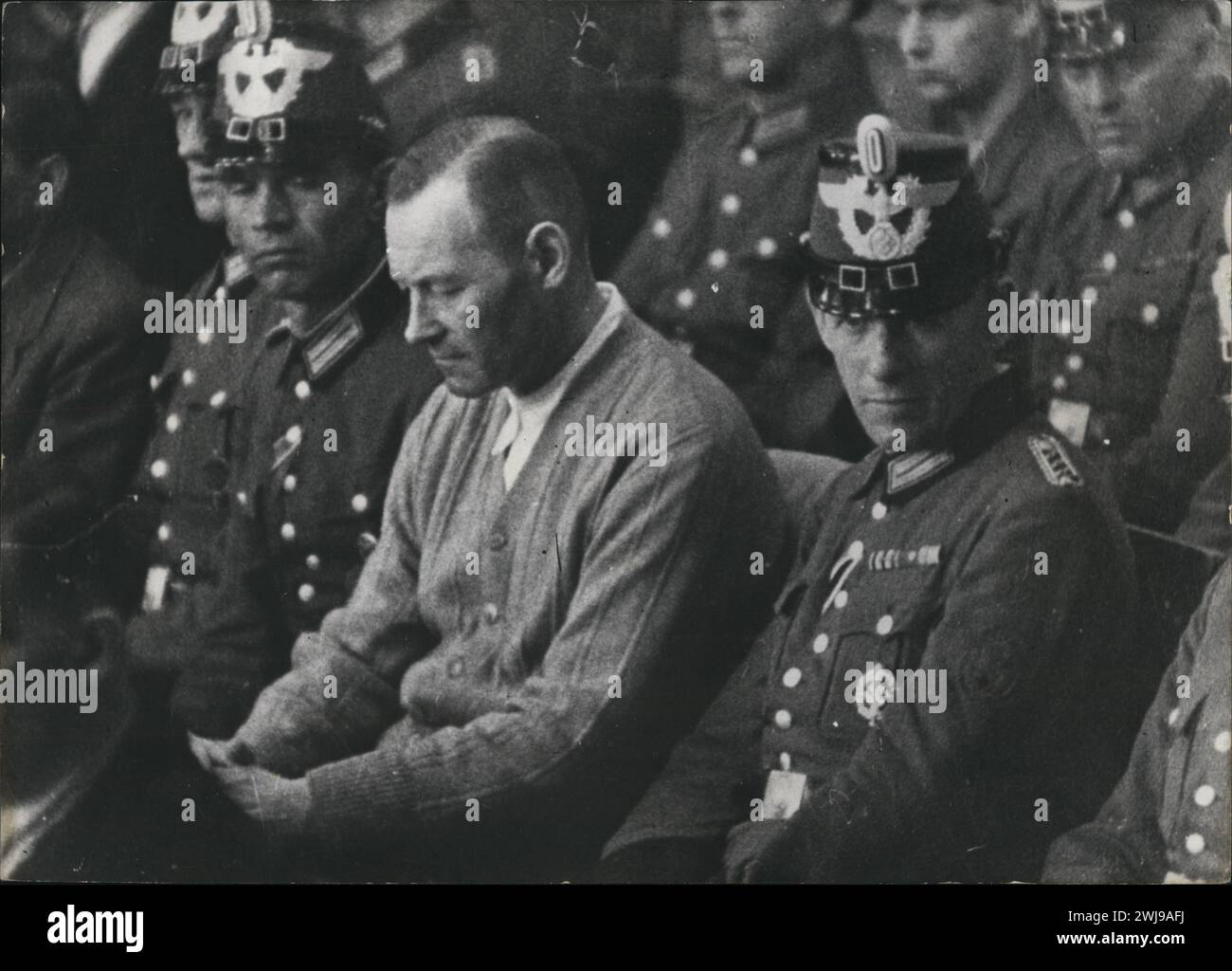 August 7, 1944, Berlin, Germany: Former German COLONEL-GENERAL ERICH KURT RICHARD HOEPNER (born September 14,1886), 57, in the People's Court (Volksgerichtshof), in the Great Hall of the Berlin Chamber Court on Elßholzstrasse, on the accused bench, dressed in a cardigan. Hoepner is on trial for being named a member of the failed Hitler 20 July Cup attempt. Hoepner was humiliated by being made to wear ill-fitting clothes, and not being allowed to have his false teeth. After the coup failed Hoeppner had been arrested and tortured by the Gestapo. Refused an opportunity to commit suicide and deman Stock Photo