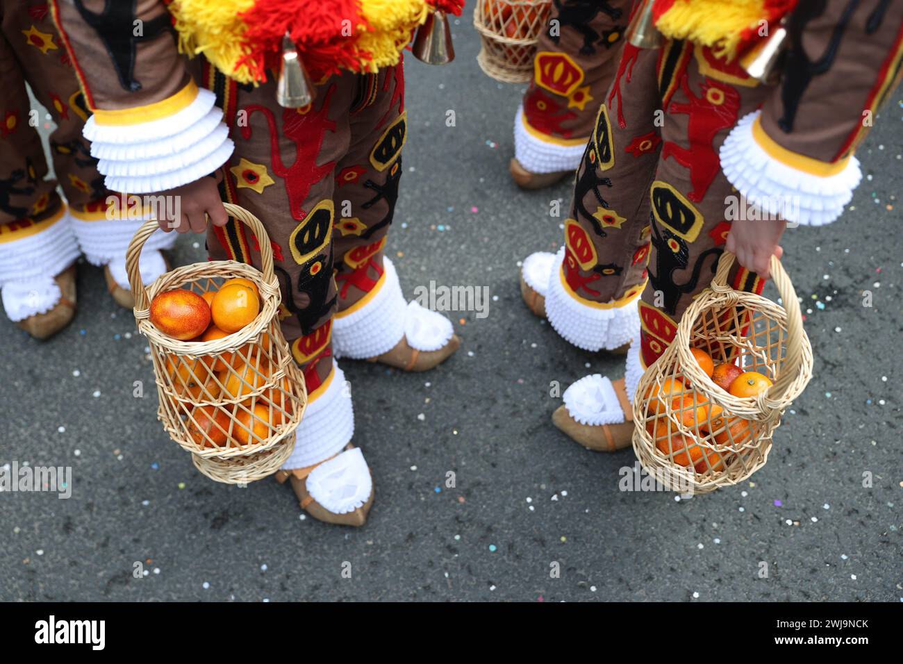 binche-belgium-13th-feb-2024-oranges-symbolizing-good-luck-are