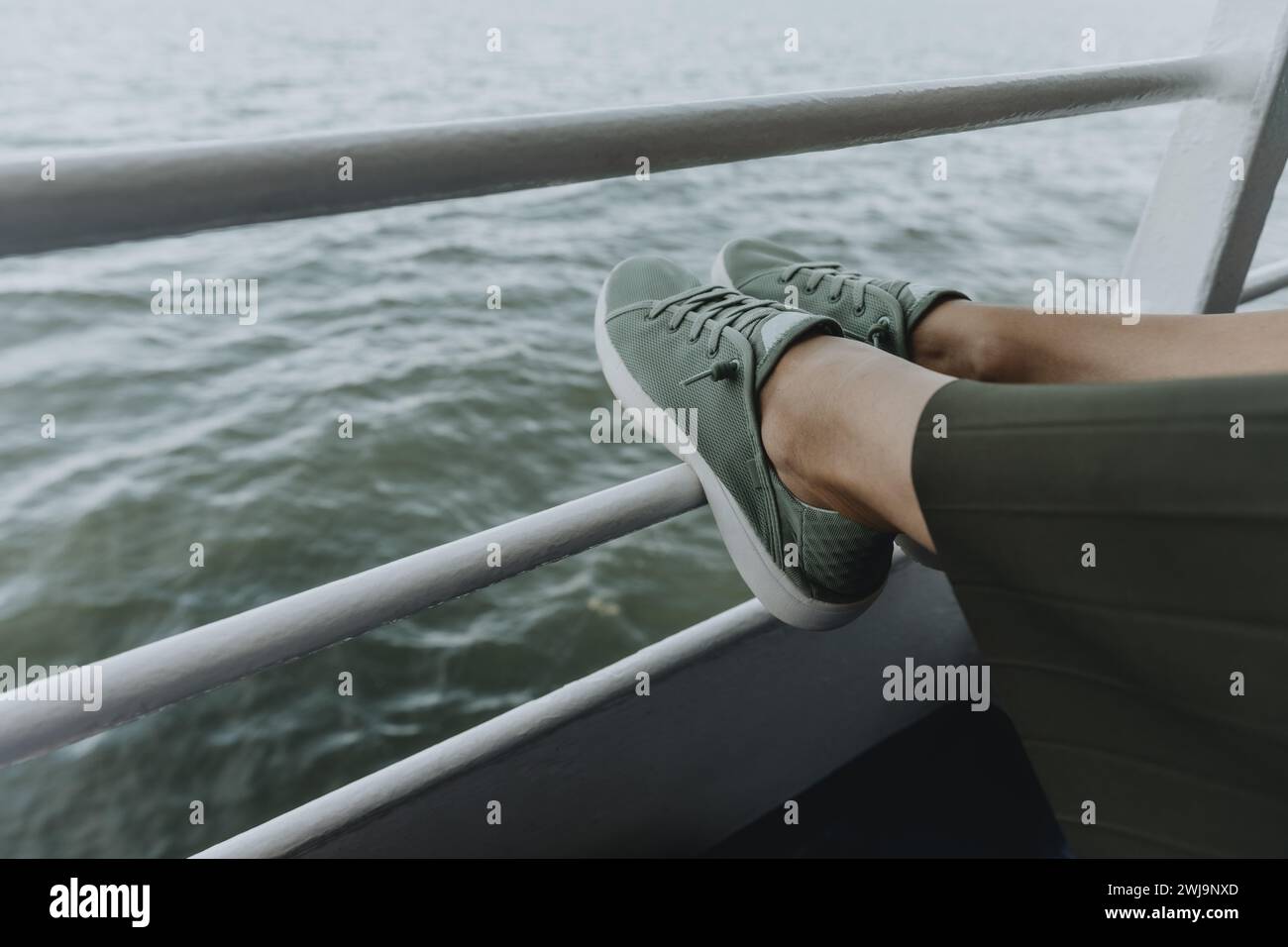 Resting On Railing Legs on cruise railing hi-res stock photography and images - Alamy