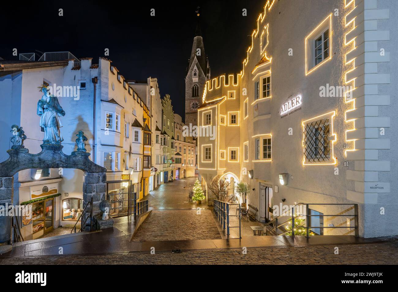 Street adorned with festive Christmas lights, Brixen-Bressanone, South Tyrol, Italy Stock Photo