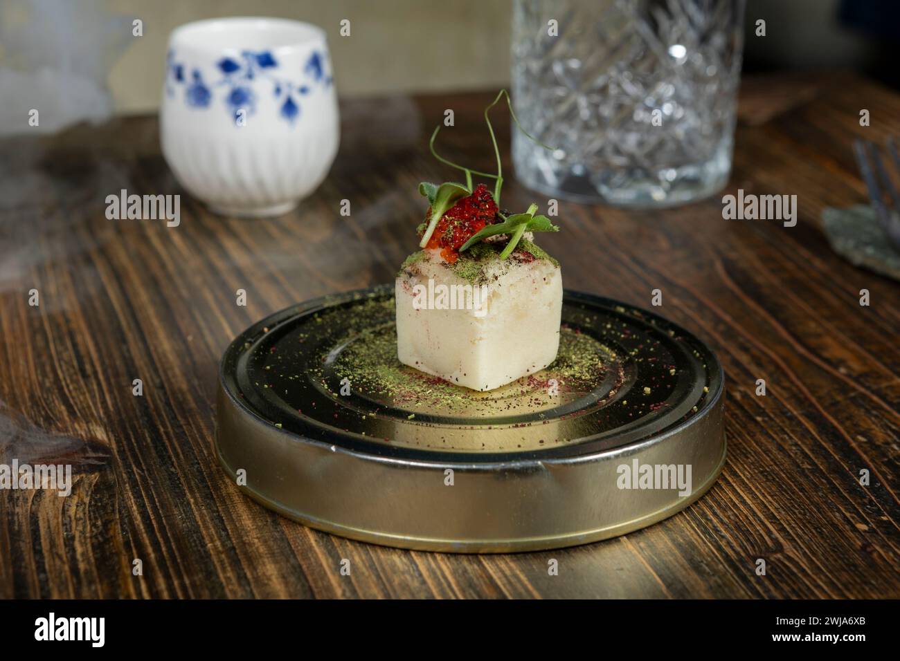 Exquisite fusion dish prepared with local and seasonal products, served at a Michelin-starred restaurant in Zermatt, Switzerland, showcasing culinary Stock Photo
