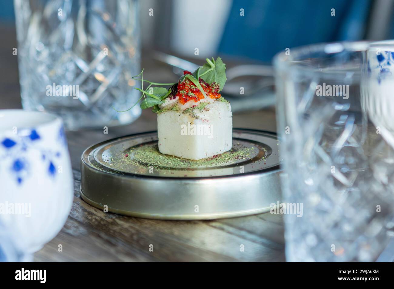 Exquisite fusion dish served at a Michelin star restaurant in Zermatt, showcasing local and seasonal ingredients with an elegant presentation. Stock Photo