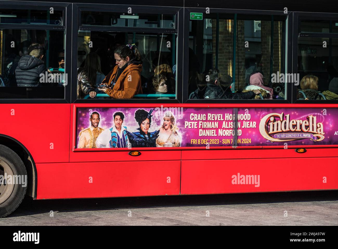 Kingston-Upon-Thames, London UK, February 12 2024, Passengers Sitting on a Red TFL Public Transport Bus Shot Close Up Through The Window Looking Insid Stock Photo