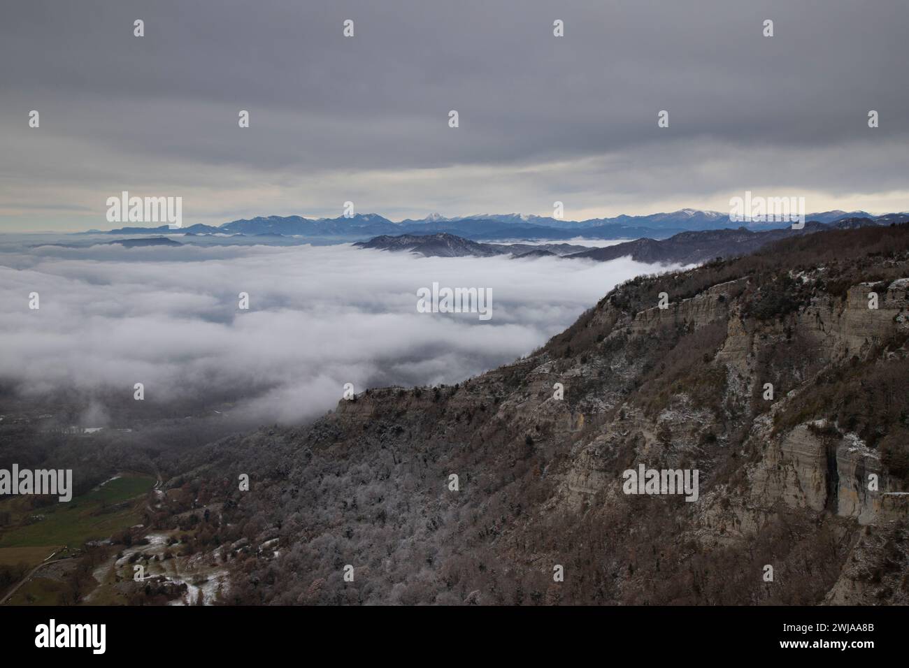 A scenic view of Pedraforca mountain in Catalonia, enveloped in mist Stock Photo