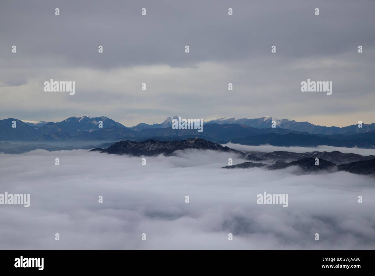 A scenic view of Pedraforca mountain in Catalonia, enveloped in mist Stock Photo