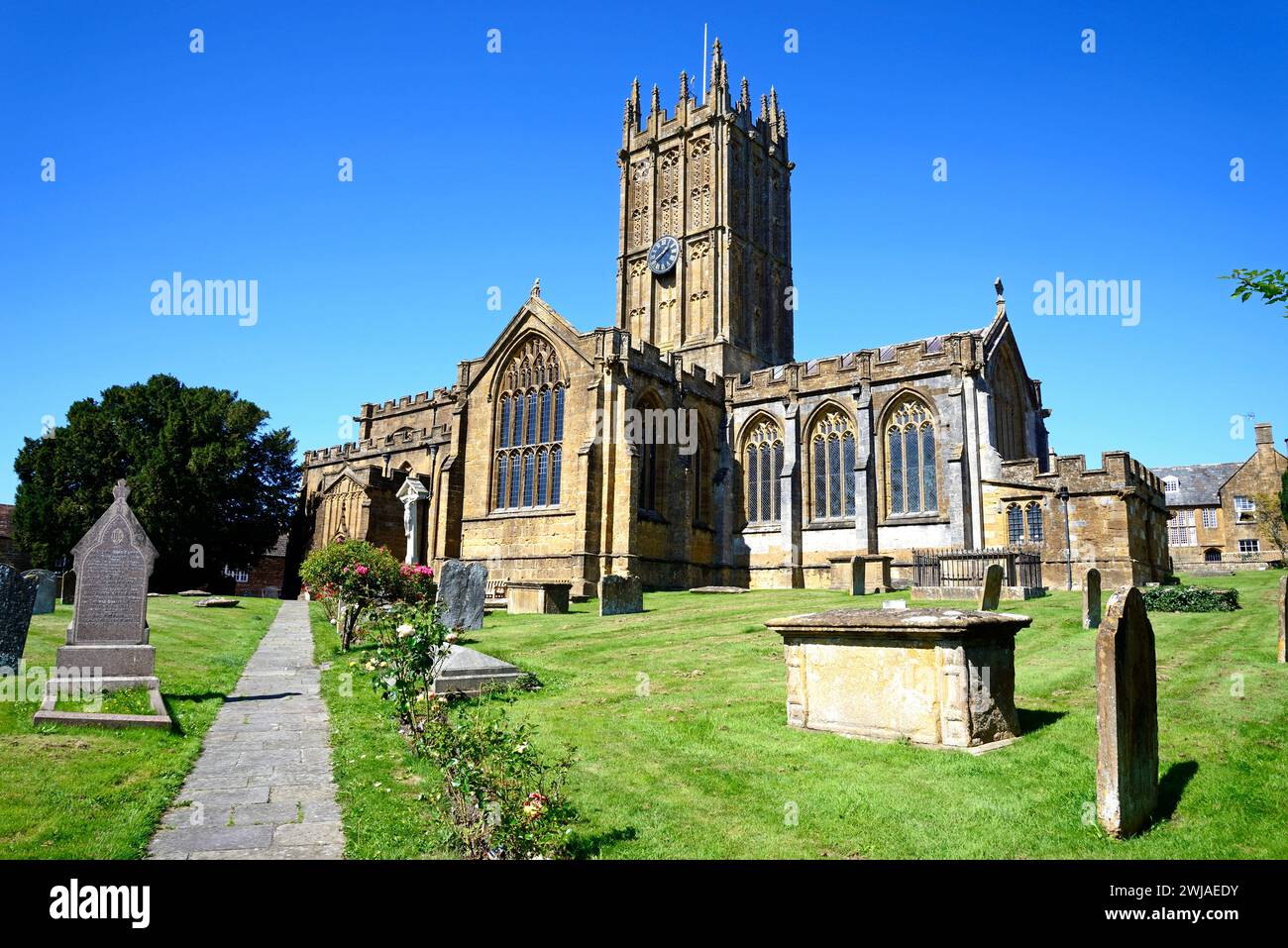 Front view of St Marys Minster Church in the town centre with the graveyard in the foreground, Ilminster, Somerset, UK. Stock Photo