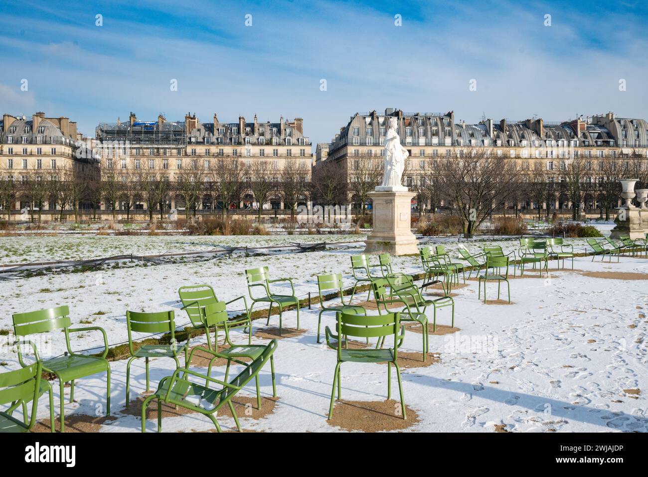 Paris, France, Snowy Tuileries gardens with classical statue in the ...