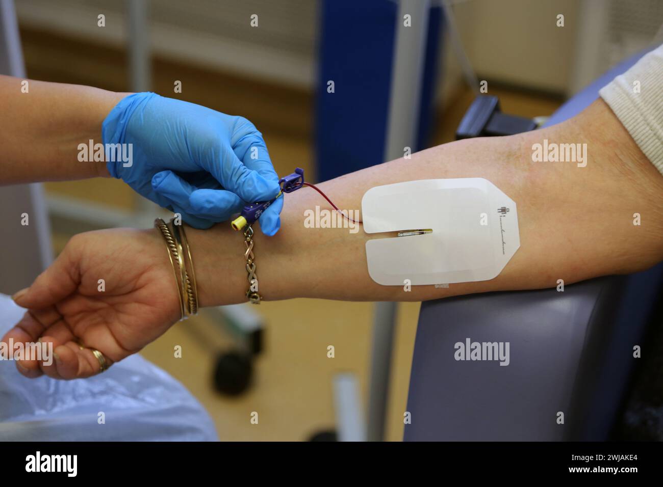 Nurse Inserting a Cannula into Patient Ready to Administer Ferinject