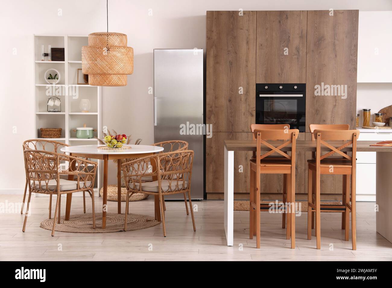 Interior of modern kitchen with tables and built-in oven Stock Photo ...
