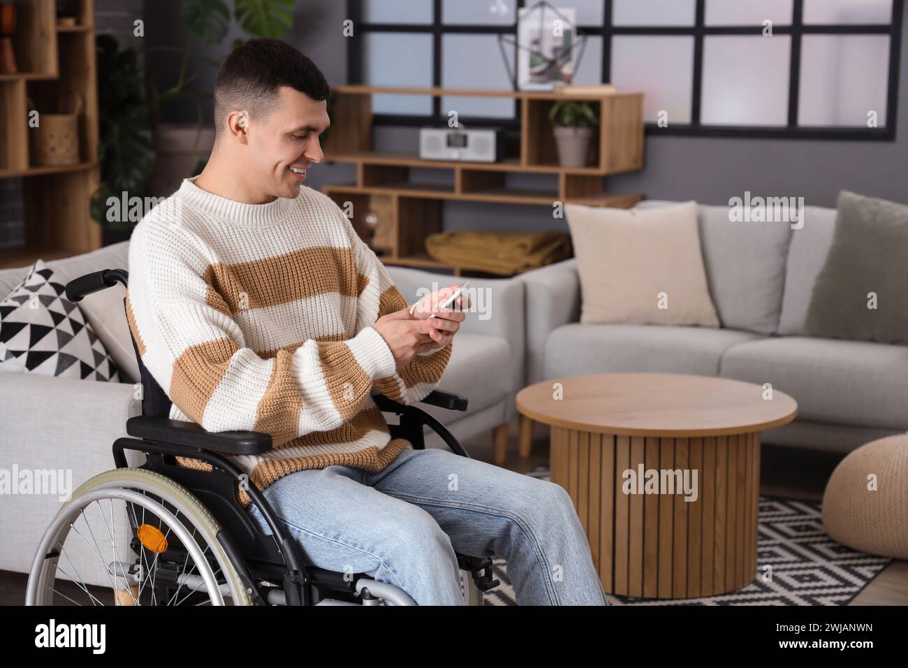 Guy in wheelchair sitting phone hi-res stock photography and images - Alamy