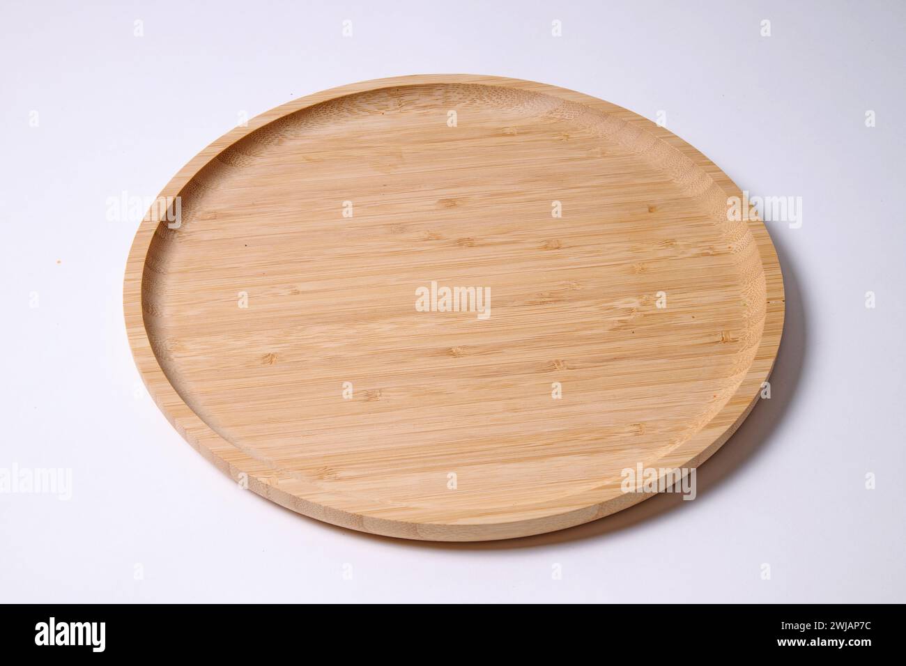 Empty Bamboo wooden round plank on white background Stock Photo