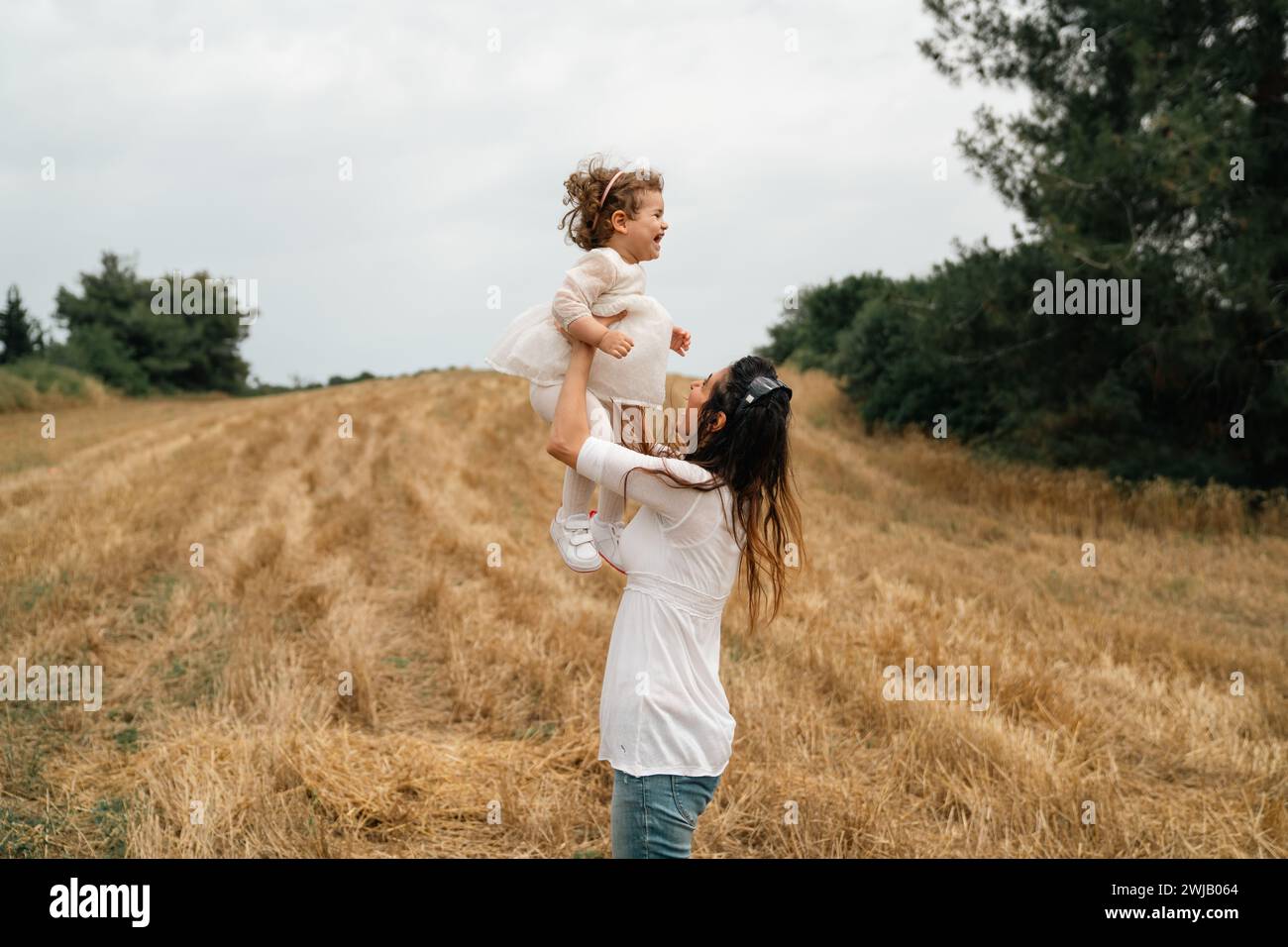 Happy family mother and her daughter in nature in summer stock photo Stock Photo