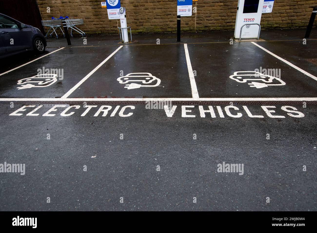Electric car charging points and e charging symbols at a Tescos