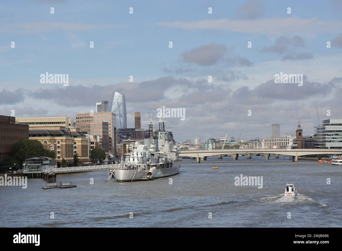 HMS Belfast is a famous museum ship and operated by the Imperial War Museum near the Tower Bridge on River Thames, London, UK Stock Photo