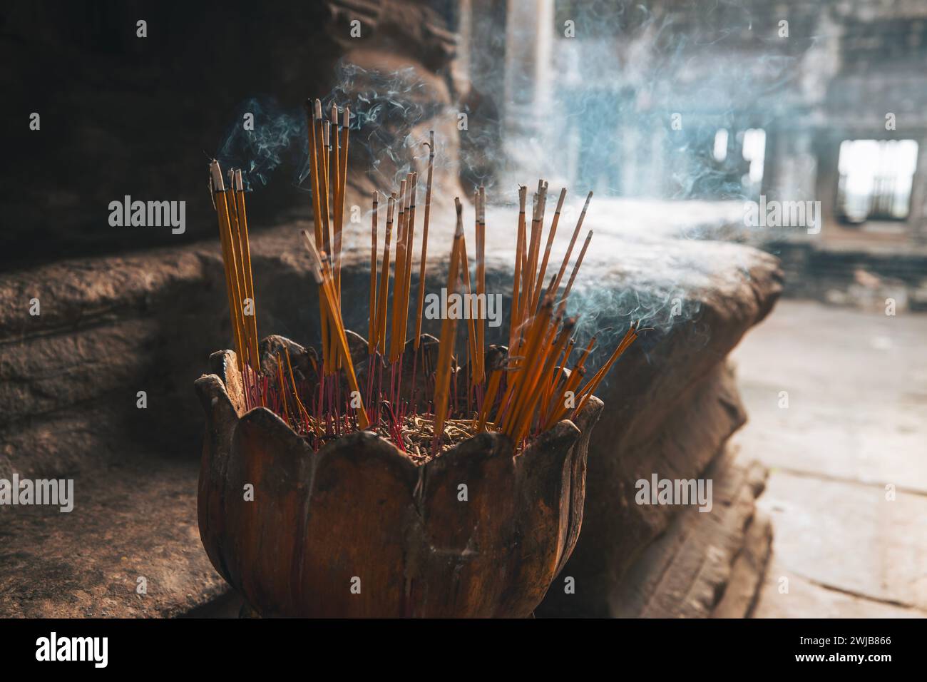 Burning incense sticks in cambodian temple hi-res stock photography and ...
