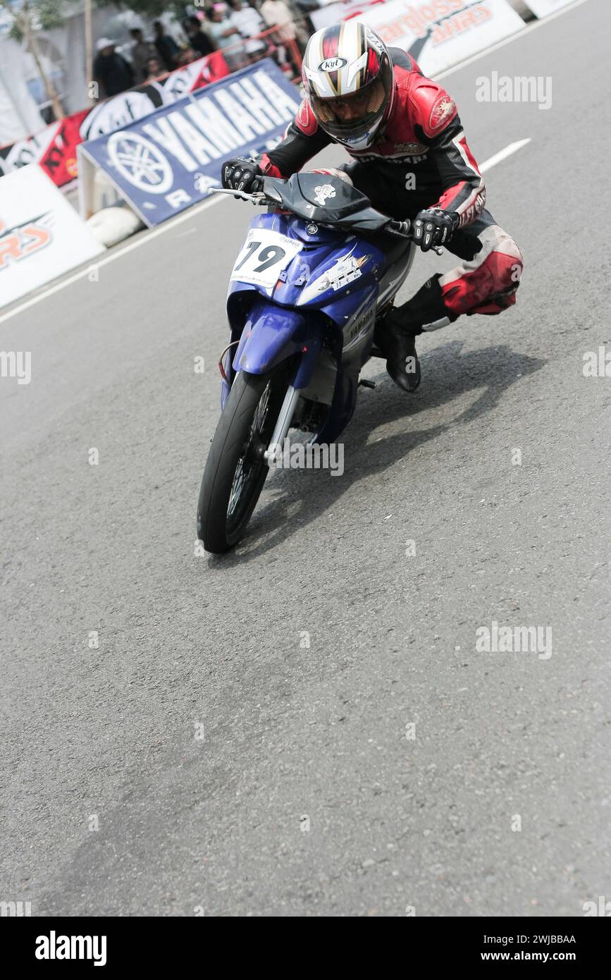 Underbone motorbike racer riding on racing track in Kediri, East Java, Indonesia. Stock Photo