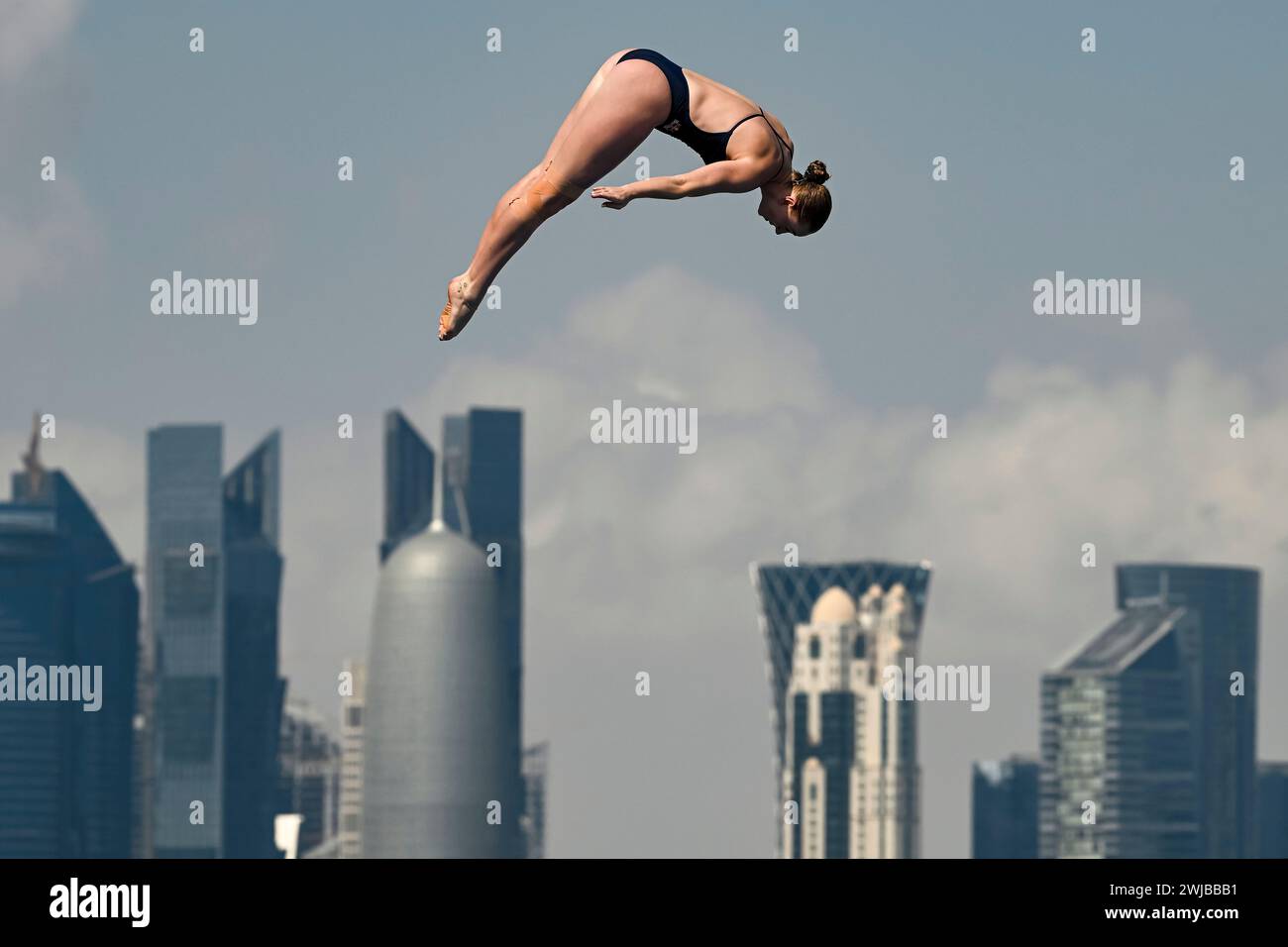 Doha, Qatar. 14th Feb, 2024. Molly Carlson of Canada competes in the high diving 20m Platform Women Round 3 - 4 during the 21st World Aquatics Championships at the Old Doha Port in Doha (Qatar), February 14, 2024. Credit: Insidefoto di andrea staccioli/Alamy Live News Stock Photo