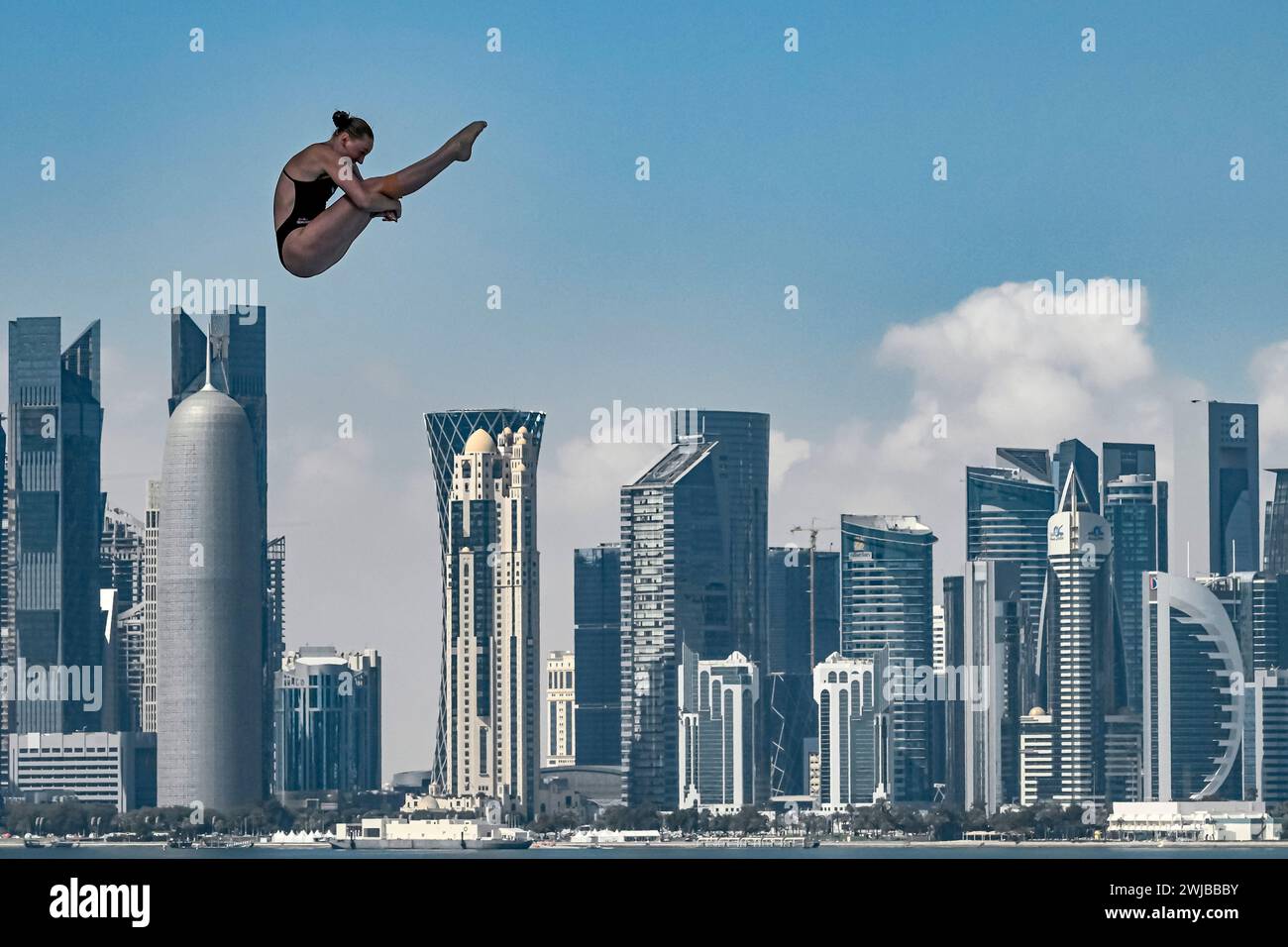 Doha, Qatar. 14th Feb, 2024. Molly Carlson of Canada competes in the high diving 20m Platform Women Round 3 - 4 during the 21st World Aquatics Championships at the Old Doha Port in Doha (Qatar), February 14, 2024. Credit: Insidefoto di andrea staccioli/Alamy Live News Stock Photo