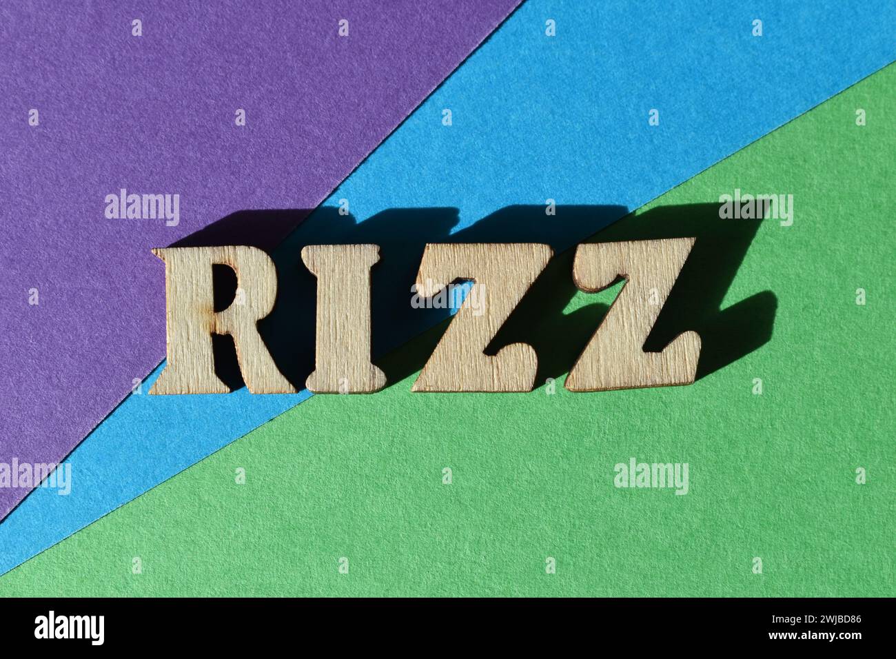 Rizz, Gen Z slang for Charisma, word in wooden alphabet letters isolated on colourful background Stock Photo