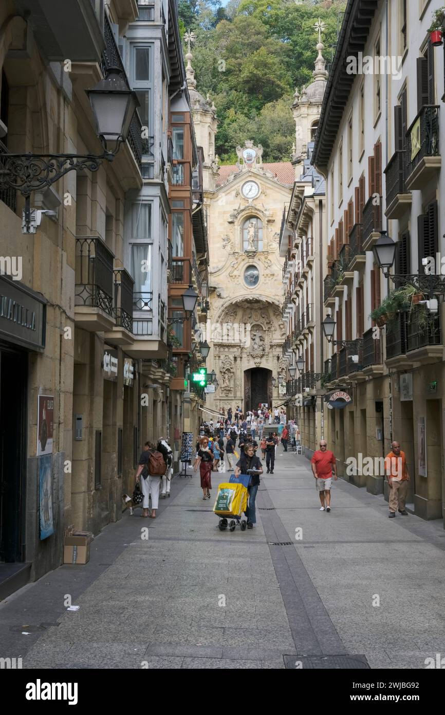 typical narrow street in the old town leads to Basilica of Saint Mary of Coroico, Donostia, San Sebastián,   Basque Autonomous Community, Spain,Europe Stock Photo