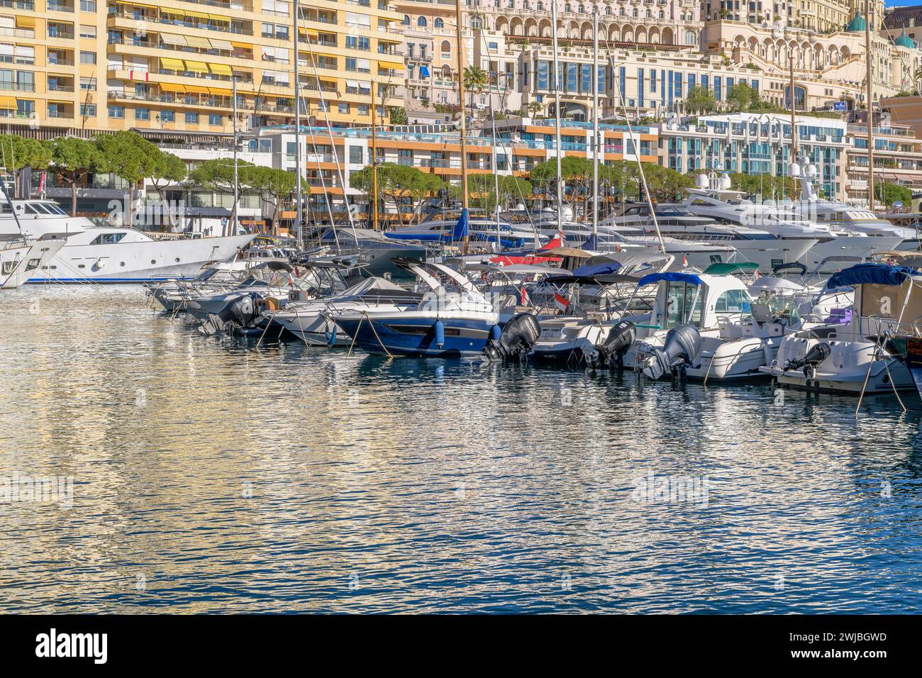 Port Hercule marina, Monte Carlo in Monaco. From here the city rises into the hills behind. Interwoven with winding roads and smart homes. Stock Photo