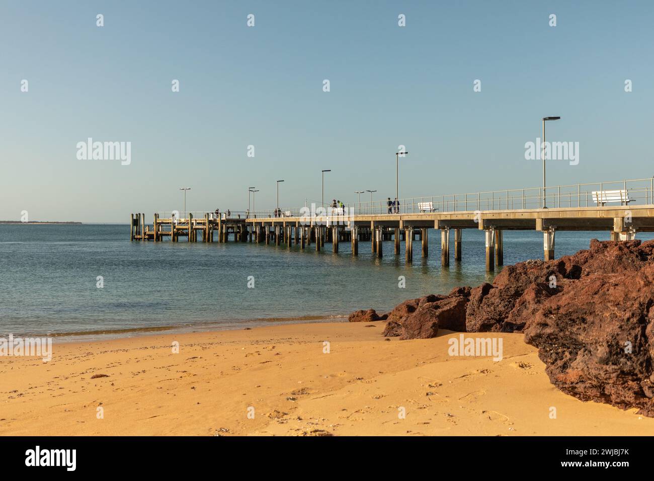 The Cowes jetty, on Phillip Island south of Melbourne, is a popular fishing and tourist spot overlooking the waters of Western Port Bay. Stock Photo