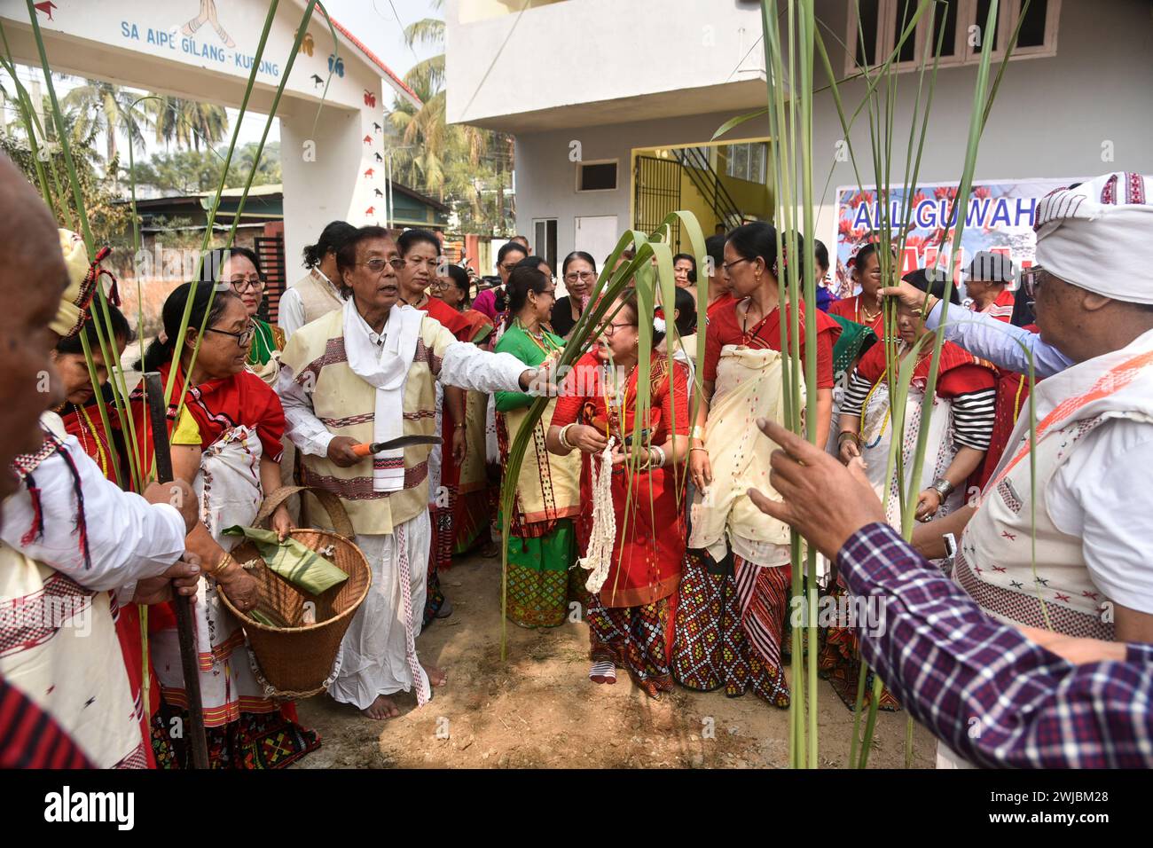 GUWAHATI,INDIA-14 FEBRUARY 2024: Mising tribal people performing rituals during Ali-Aye-Ligang festival in Guwahati, India.Ali-Aye-Ligang, the main harvest festival of the ethnic Mising community people, this spring festival associated with agriculture, especially with the beginning of the Ahu paddy cultivation. Stock Photo