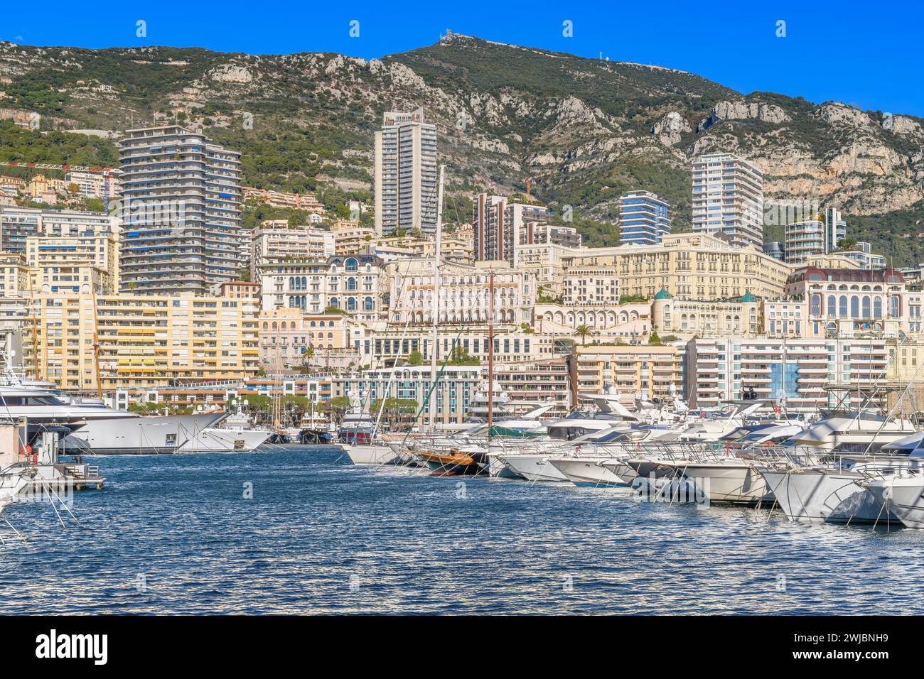 Monte Carlo in Monaco. Tightly packed luxury villas and apartments for the rich and famous. With twisting roads weaving between high rise buildings. Stock Photo