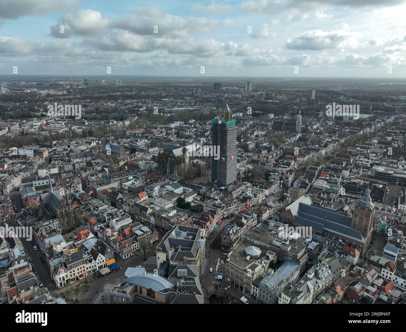 Aerial drone view on the Utrecht Cathedral in scaffolding for renovation. Gothic church in the middle of the Dutch city of Utrecht . Monument and city Stock Photo