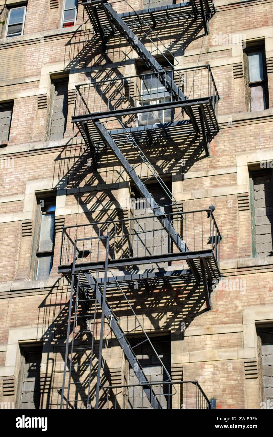 fire escape in sunlight and shadows Stock Photo