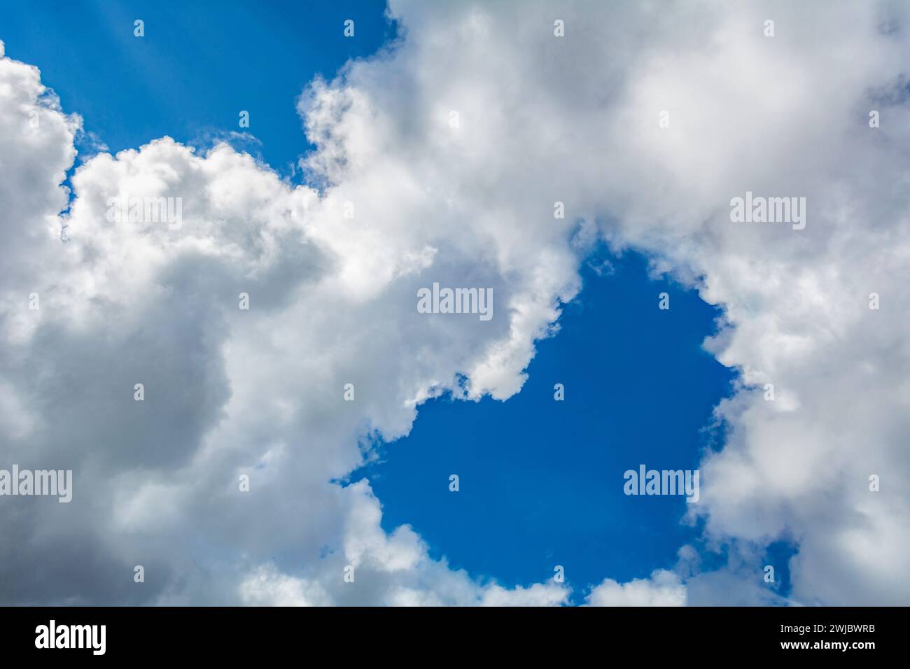 heart shaped cloud in the blue sky Stock Photo
