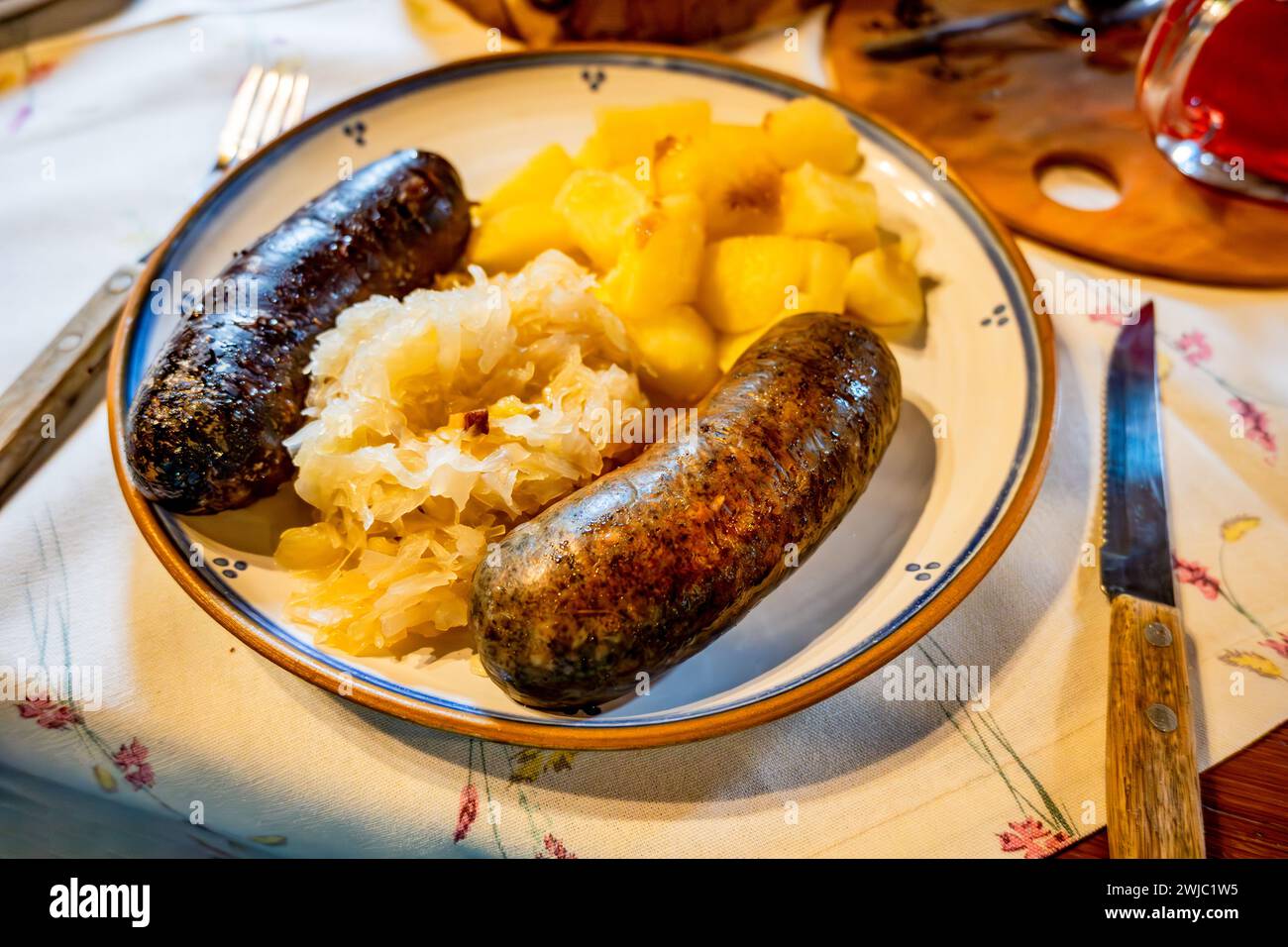 Baked White And Black Pudding sausage With Stewed Cabbage And Boiled baked-white-and-black-pudding-sausage-with-stewed-cabbage-and-boiled