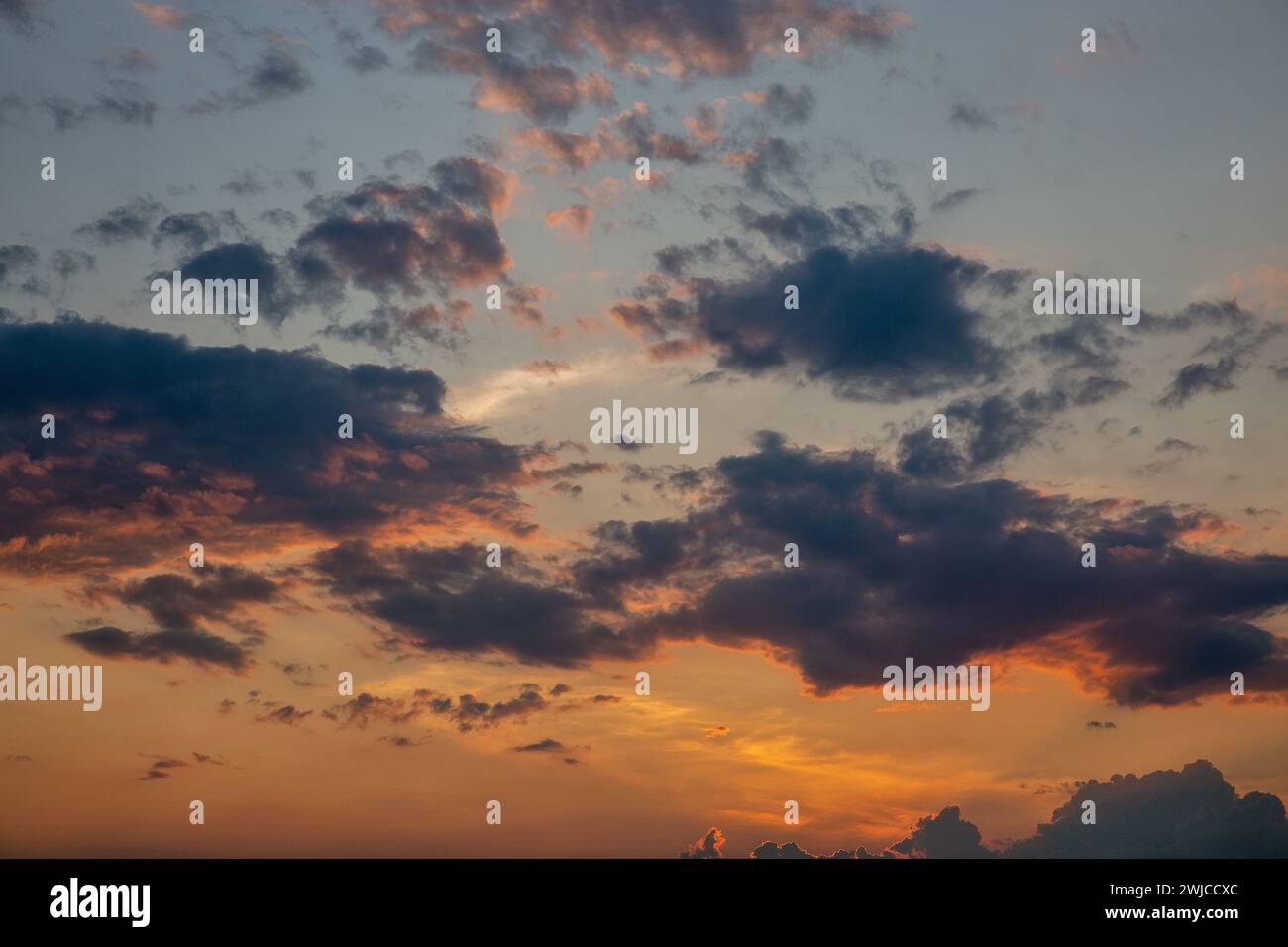sunset dramatic cloudy sky background on a summer evening Stock Photo ...