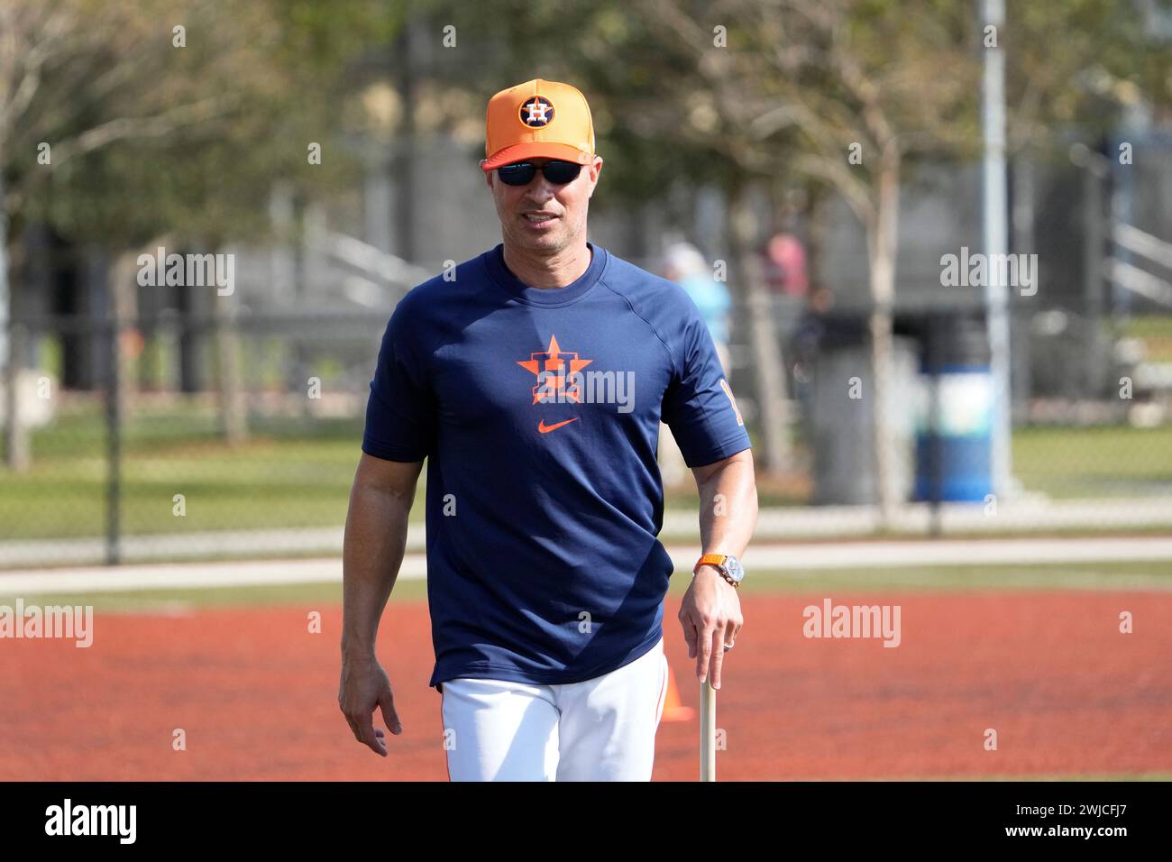 Houston Astros manager Joe Espada roams the practice fields during a