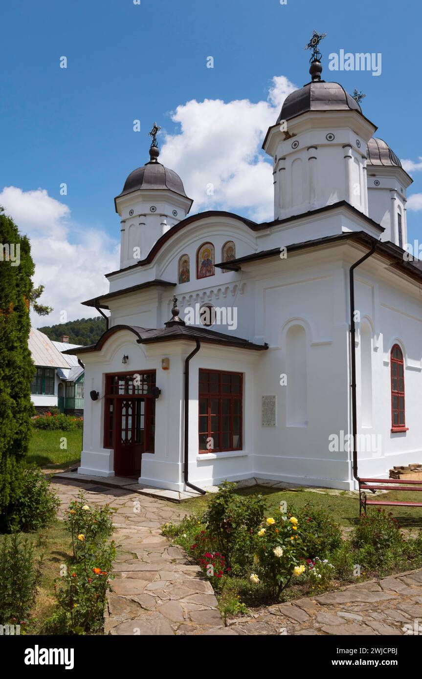 A white church with two domes and crosses against a clear blue sky, Orthodox Nunnery Suzana, Maneciu, Maneciu, Prahova, Muntenia, Romania Stock Photo