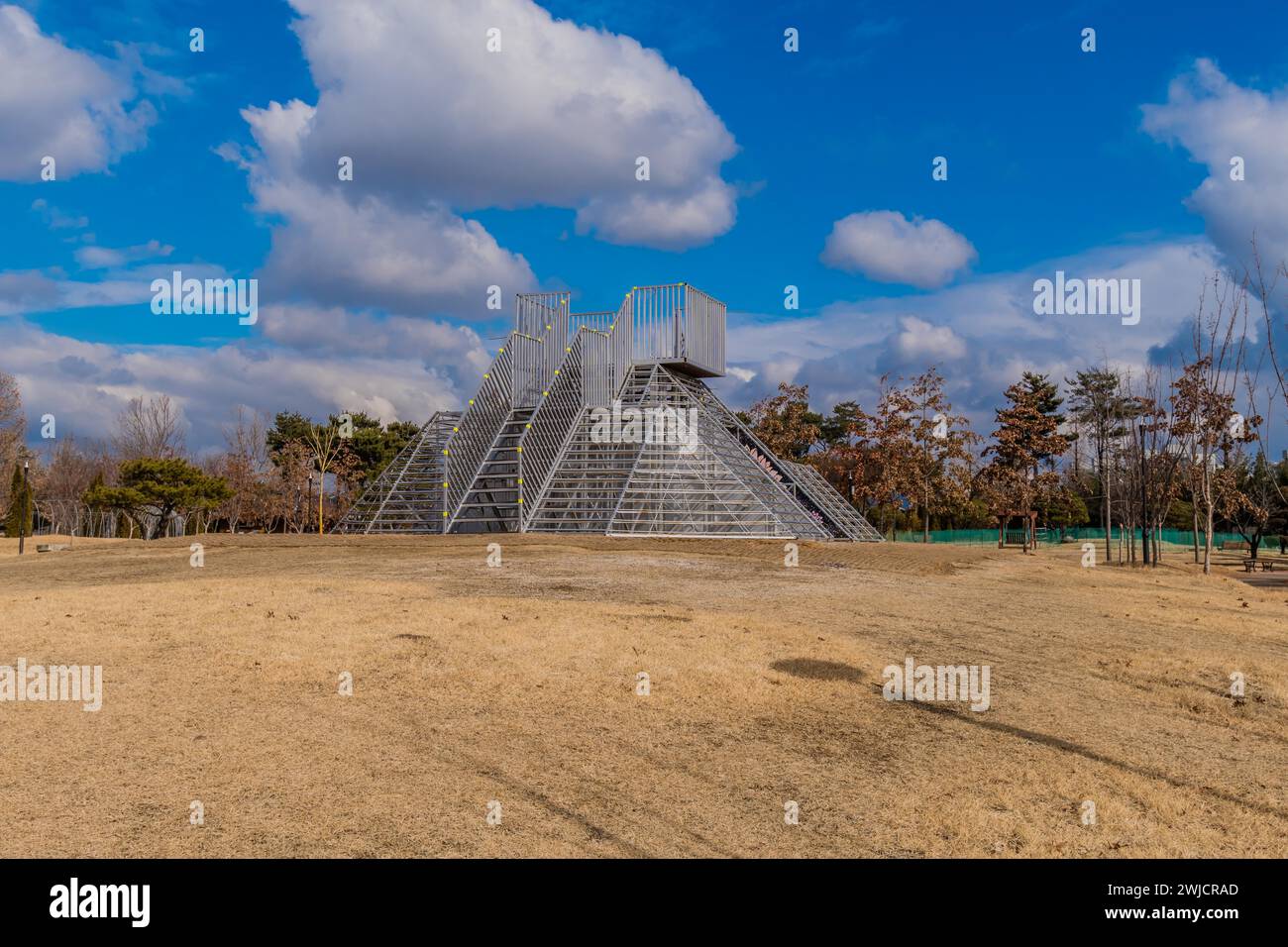 Metal pyramid observation tower in public urban park under beautiful blue cloudy sky in Daejeon, South Korea Stock Photo