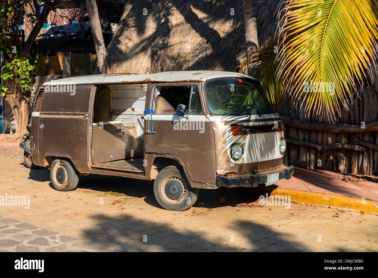 Old disused VW Bus T2 parked on a street in Zibolite, San Pedro Pochutla, Baja de Hualtulco, South Pacific Coast, State of Oaxaca, Mexico, Central Stock Photo