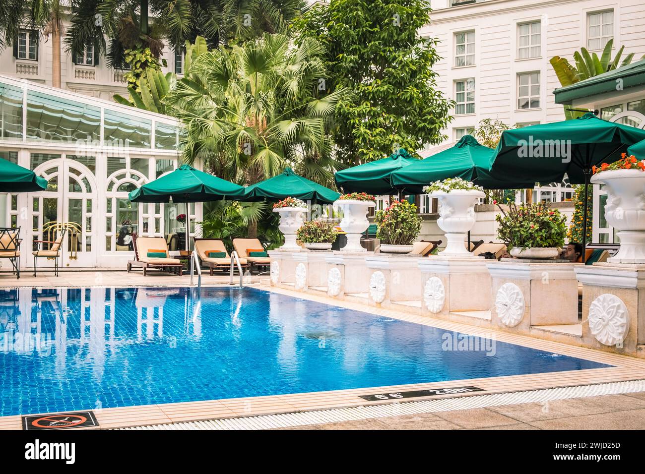 Outdoor swimming pool at the Sofitel Legend Metropole hotel, Hanoi, Vietnam Stock Photo
