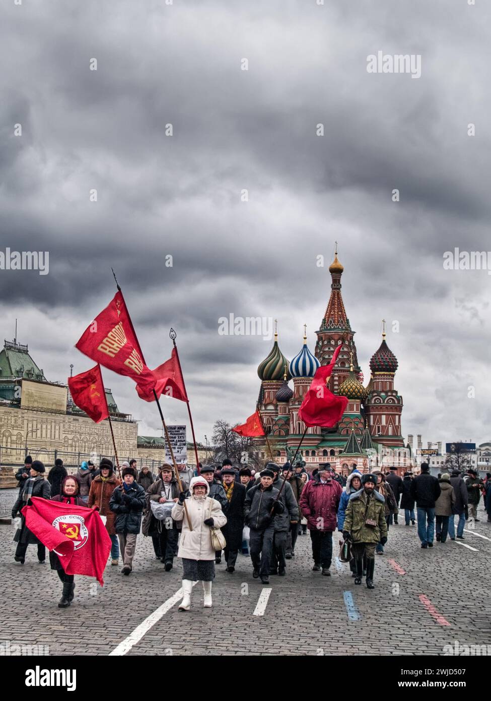 Group of demonstrators with communist flags on Red Square in Moscow, Russia. Stock Photo