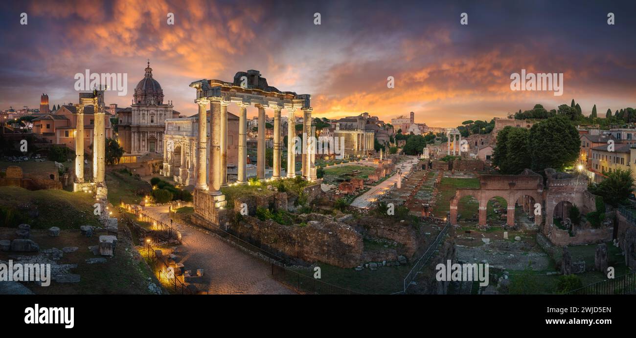 Amazing cityscape scene of the Roman Forum in Rome, Italy, at dusk, with dramatic colorful sky and clouds after sunset Stock Photo