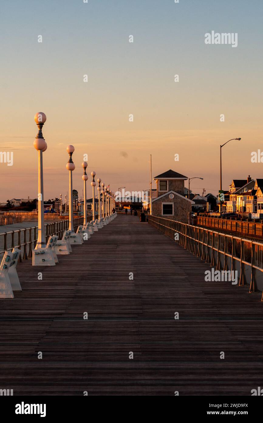 Avon By the Sea, New Jersey, USA - Golden hour sunrise on the boardwalk Stock Photo