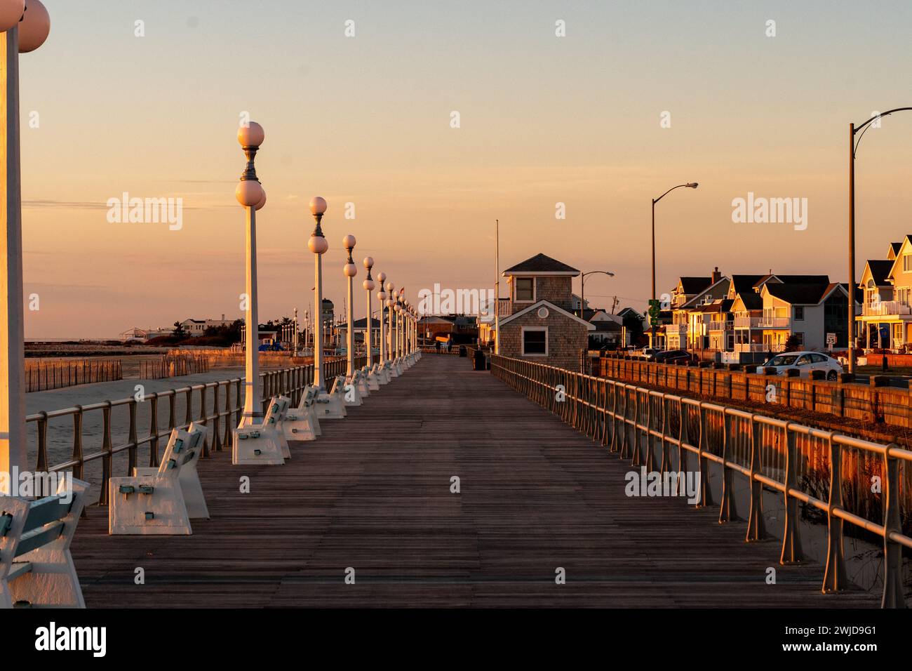 Avon By the Sea, New Jersey, USA - Golden hour sunrise on the boardwalk Stock Photo